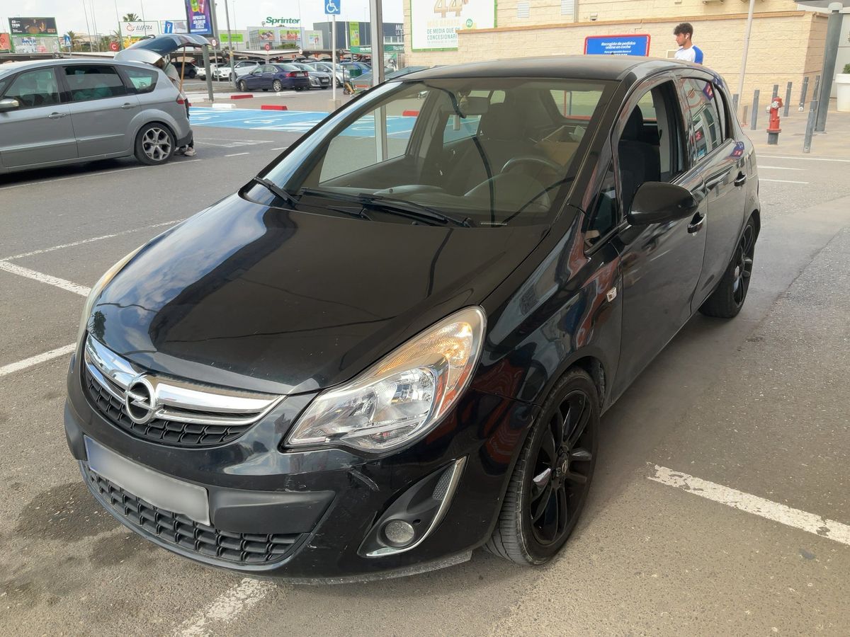 Opel Corsa 2012 — photo 1